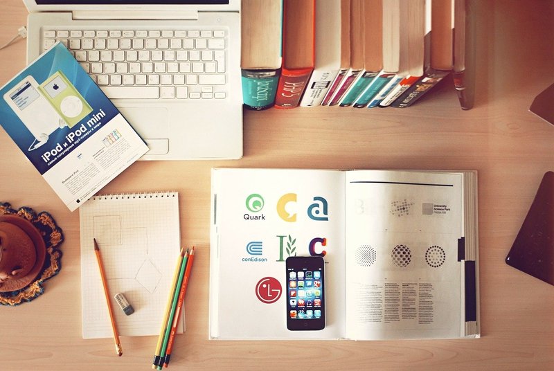 desk with computer and books